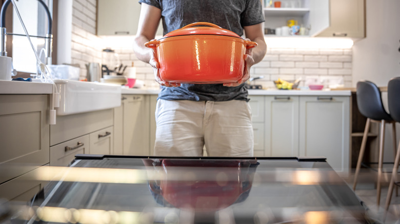 Placing pot in oven