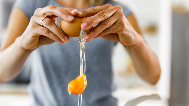 Eggs being cracked into bowl