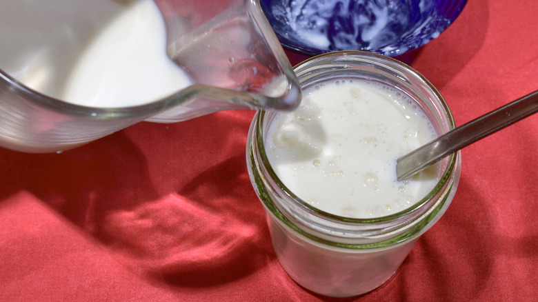 pouring liquid into jar