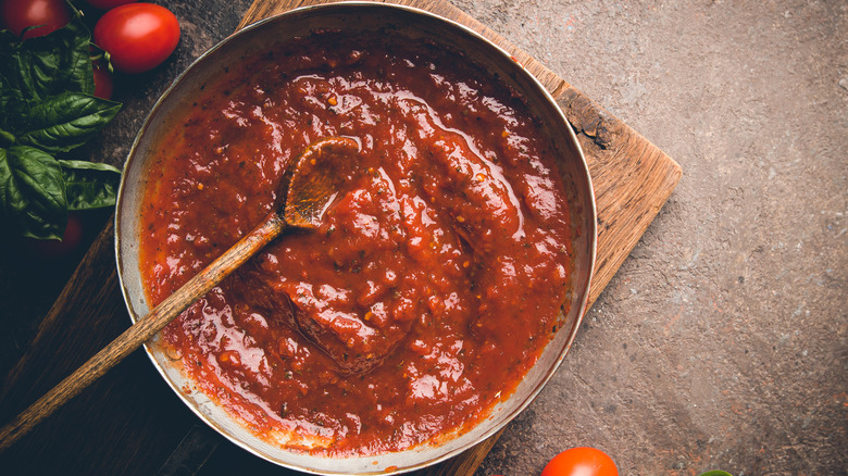 Pasta sauce in a rustic metal serving bowl