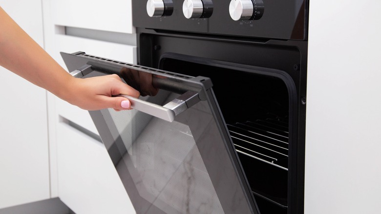 Opening conventional oven door