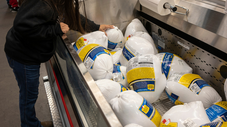 Frozen turkey in grocery freezer