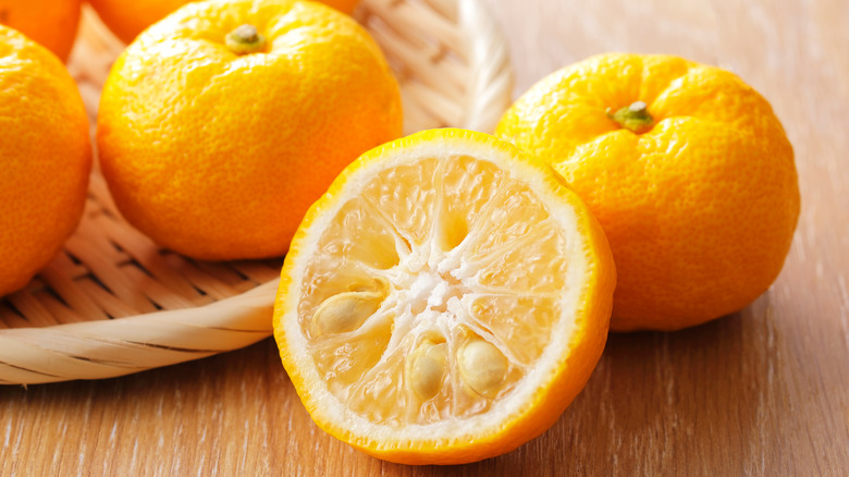 Yuzu lemons on a wooden table