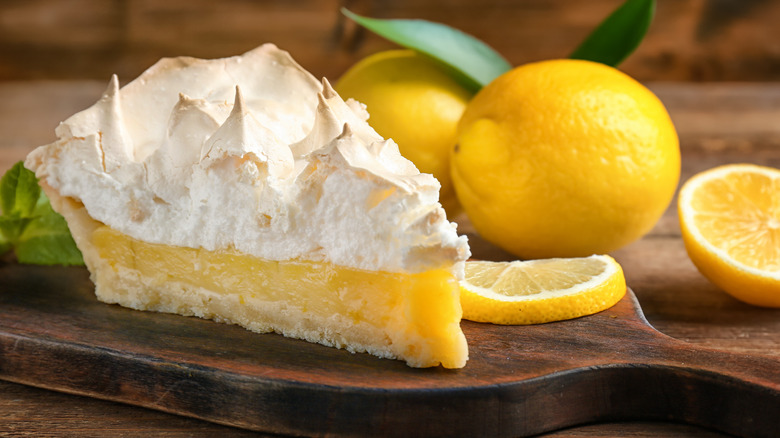 Lemon meringue pie on cutting board