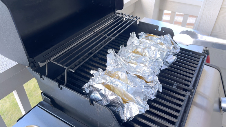 Corn in aluminum foil on grill