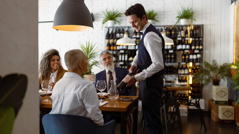 Server waiting on a table in a fine dining restaurant