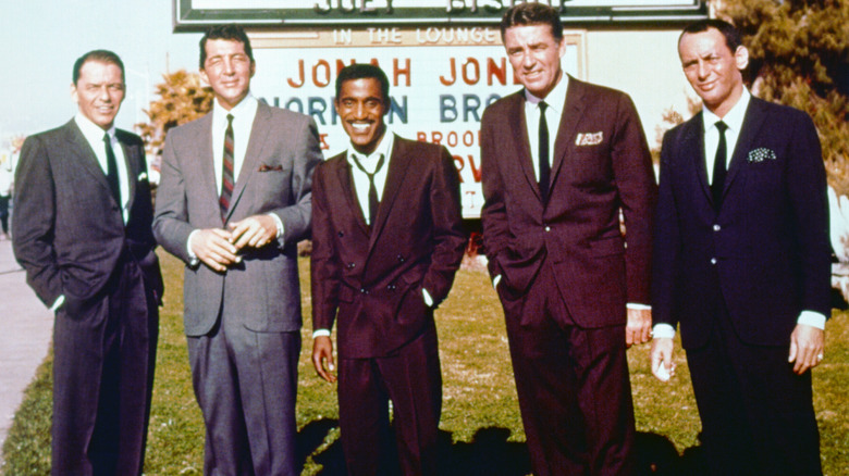 Rat Pack posing beside Vegas marquee