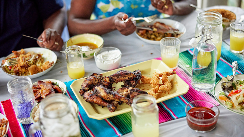 Couple eating Jamaican chicken and rice