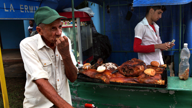 Cuban street vendors with grilled barbecue meats