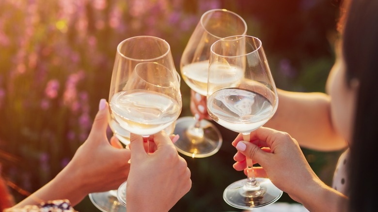 women toasting white wine