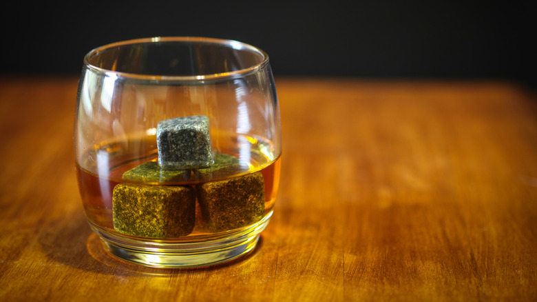 A glass of whiskey with whiskey stones