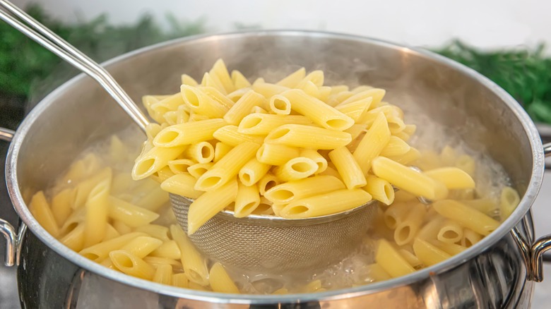 Penne pasta in silver pot