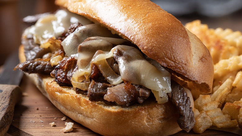 Philly cheesesteak on wood board 