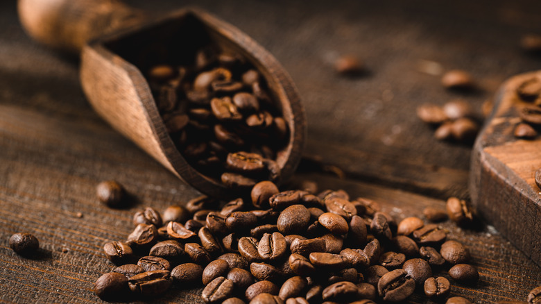 Coffee beans with wooden scoop