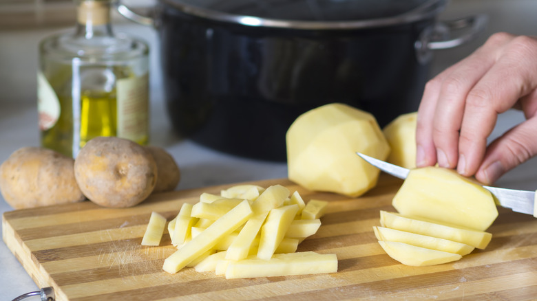 prepping potatoes for french fries