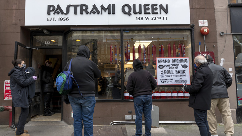 people standing outside Pastrami Queen