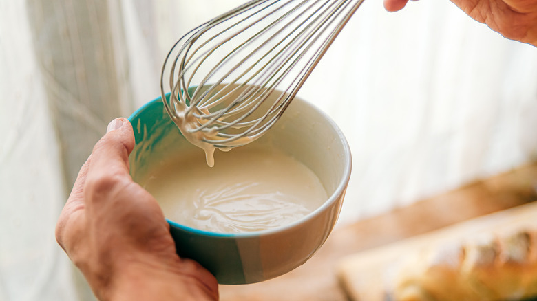 whisking dipping sauce in a bowl