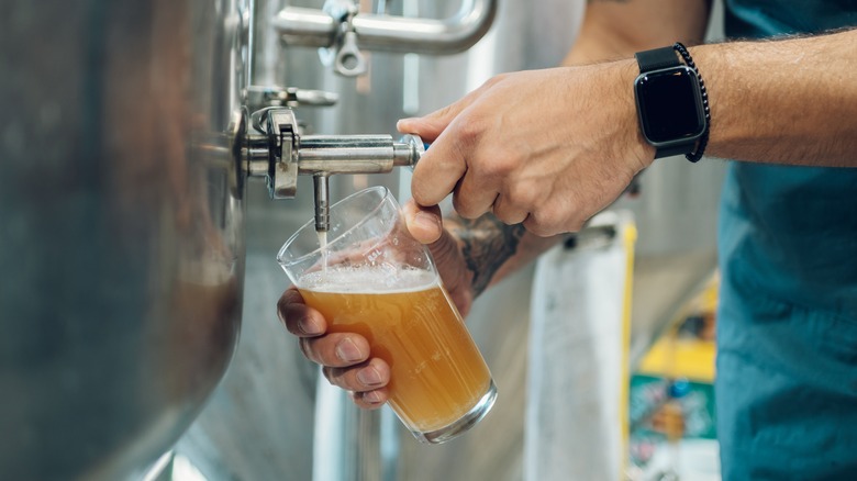 Pouring beer at brewery