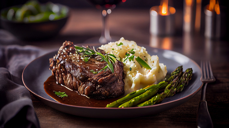 steak with mashed potatoes and asparagus