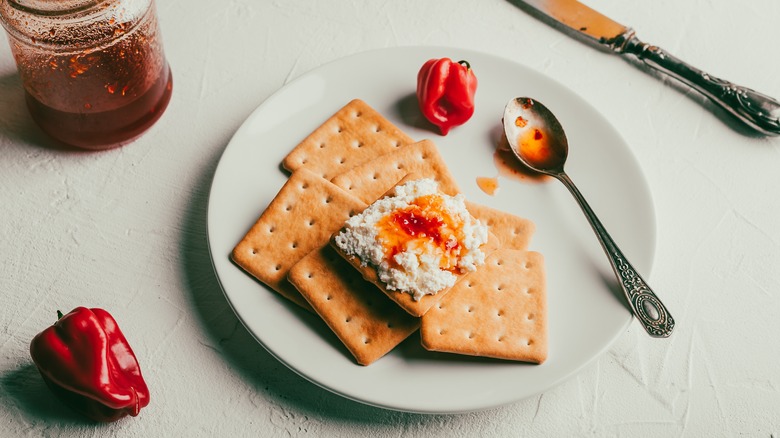 pepper jelly and cheese on crackers