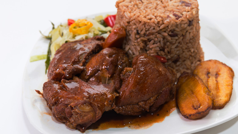 A plate of jerk chicken with rice