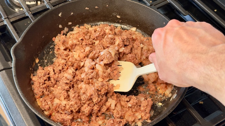 Cooking plant-based meat in pan