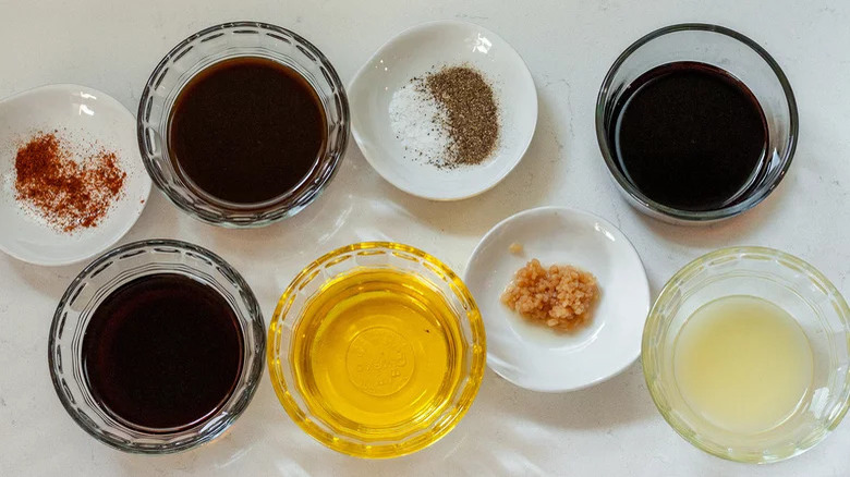 Ingredients for a tenderizing steak marinade in bowls