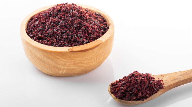 sumac spice in wooden bowl