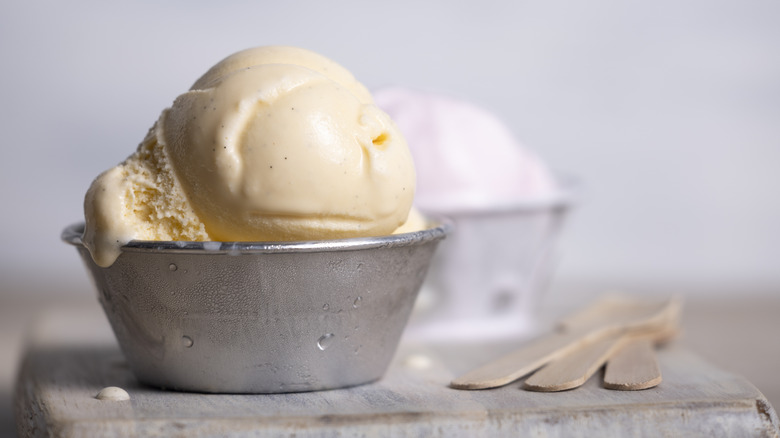 Scoop of vanilla ice cream in cup