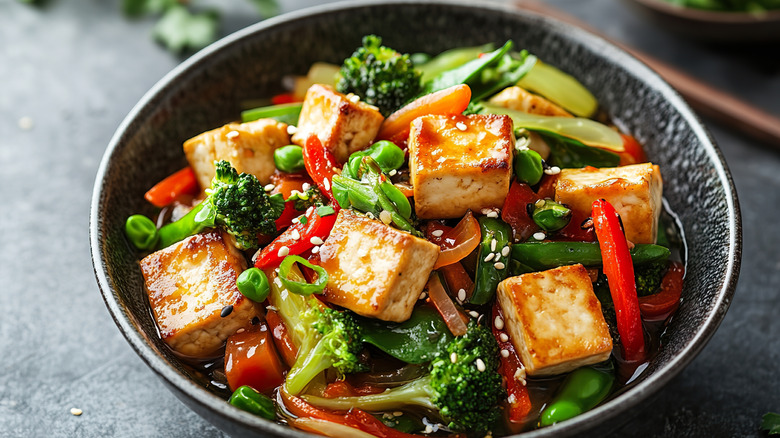 tofu and vegetable stir fry in a bowl