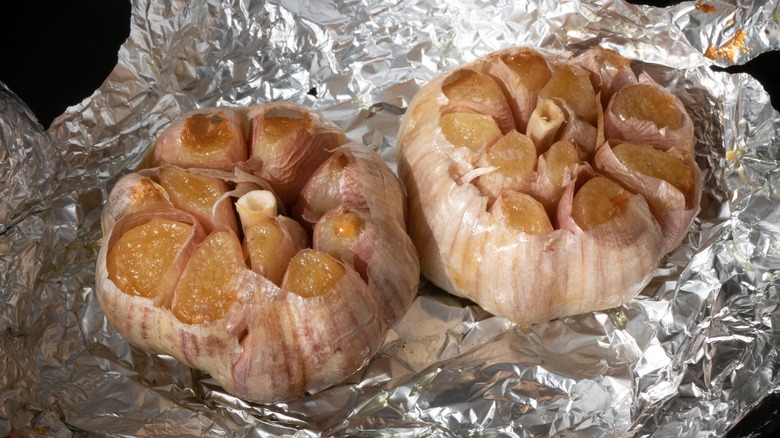 Roasted garlic cloves on tin foil 