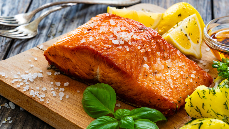 grilled salmon on wooden board