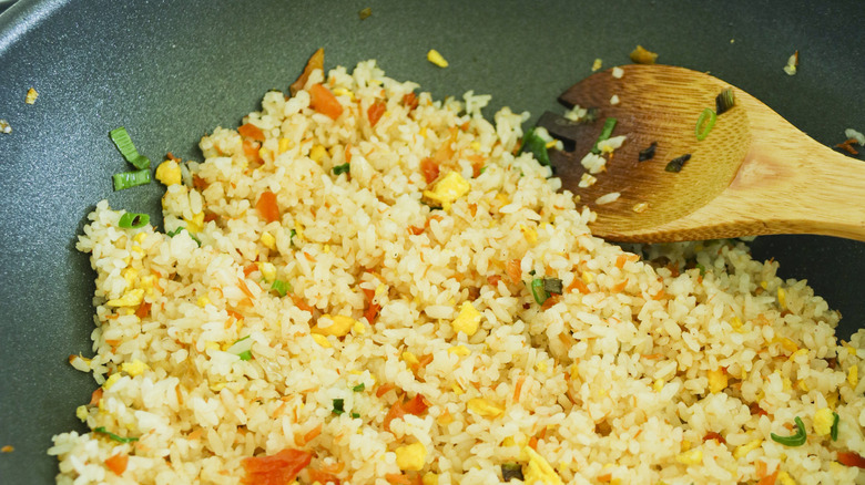 fried rice in pan with spoon