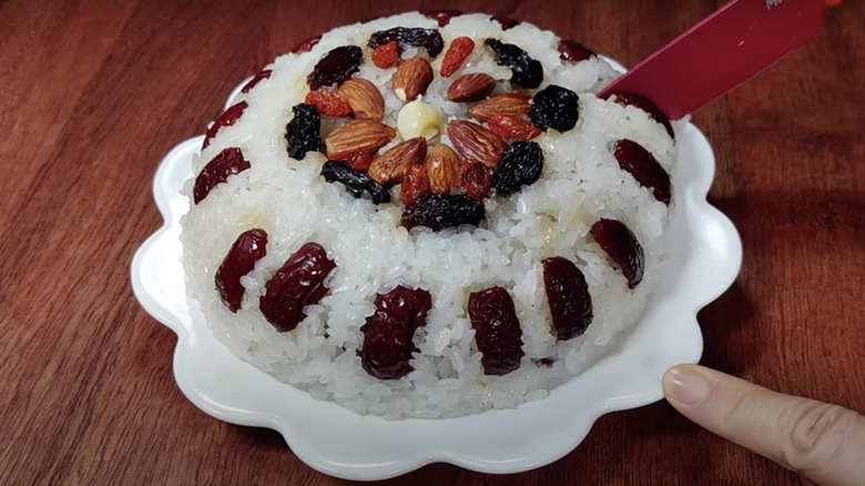 Eight Treasure rice with knife