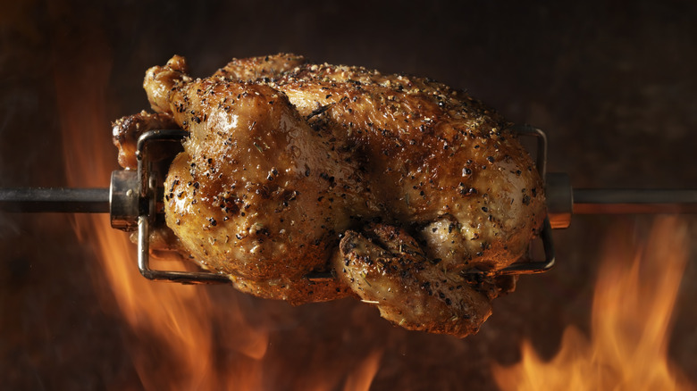 Rotisserie chicken on a spit