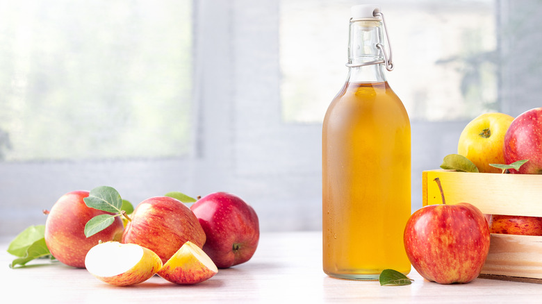 Apple cider bottle with apples