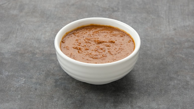 Thai peanut sauce in a white dish