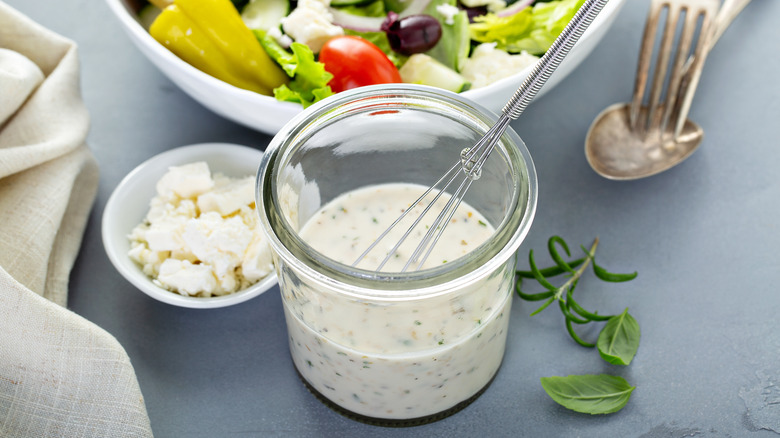 mixing salad with horseradish