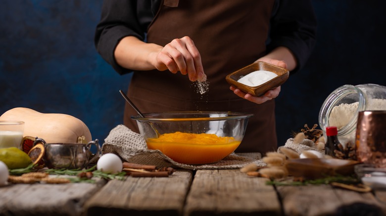 Chef preparing pumpkin pie filling