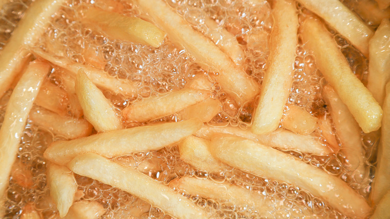 Frying chips in oil.