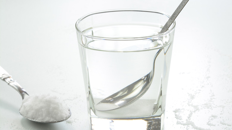 Salt being added to water