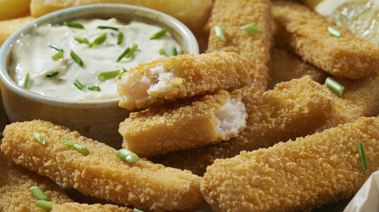 Fish sticks plated with fries 