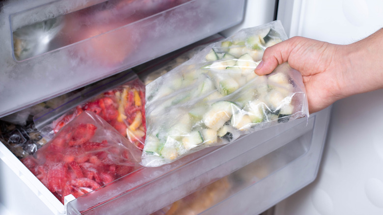 Bags of veggies in a freezer drawer