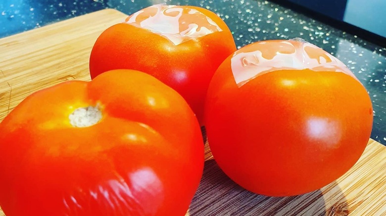 tomatoes with tape on stem
