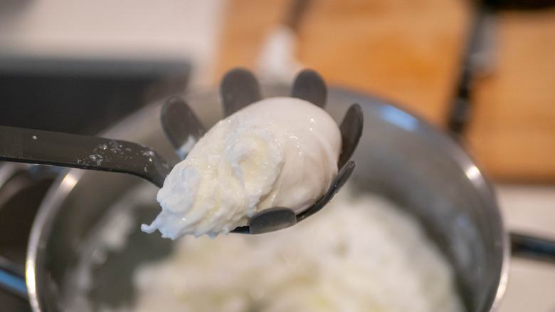 Poached egg in spoon