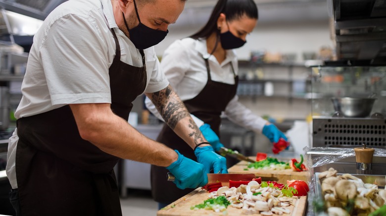 chefs preparing vegetarian food