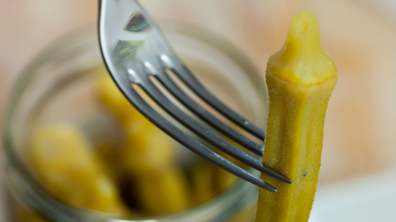 Pickled okra on fork