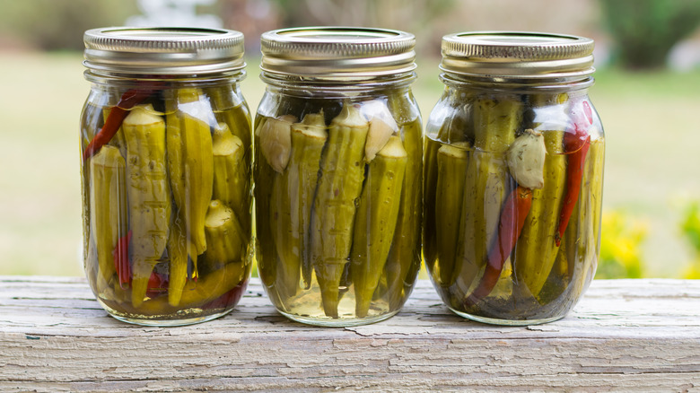 Three jars of pickled okra