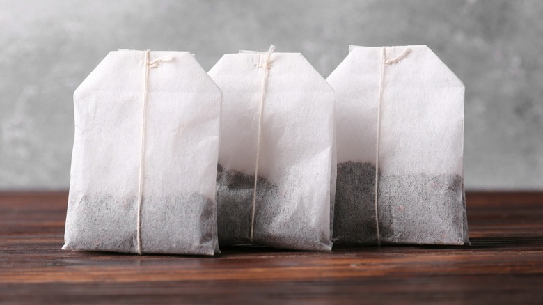 Three fresh tea bags on a counter