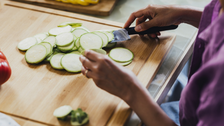 Person slicing zucchini